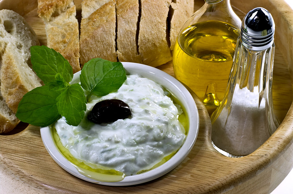 Easy Tzatziki recipe image showing serving suggestion with olive oil and traditional Greek bread